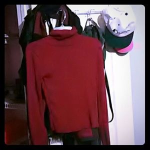 Maroon turtleneck shirt.